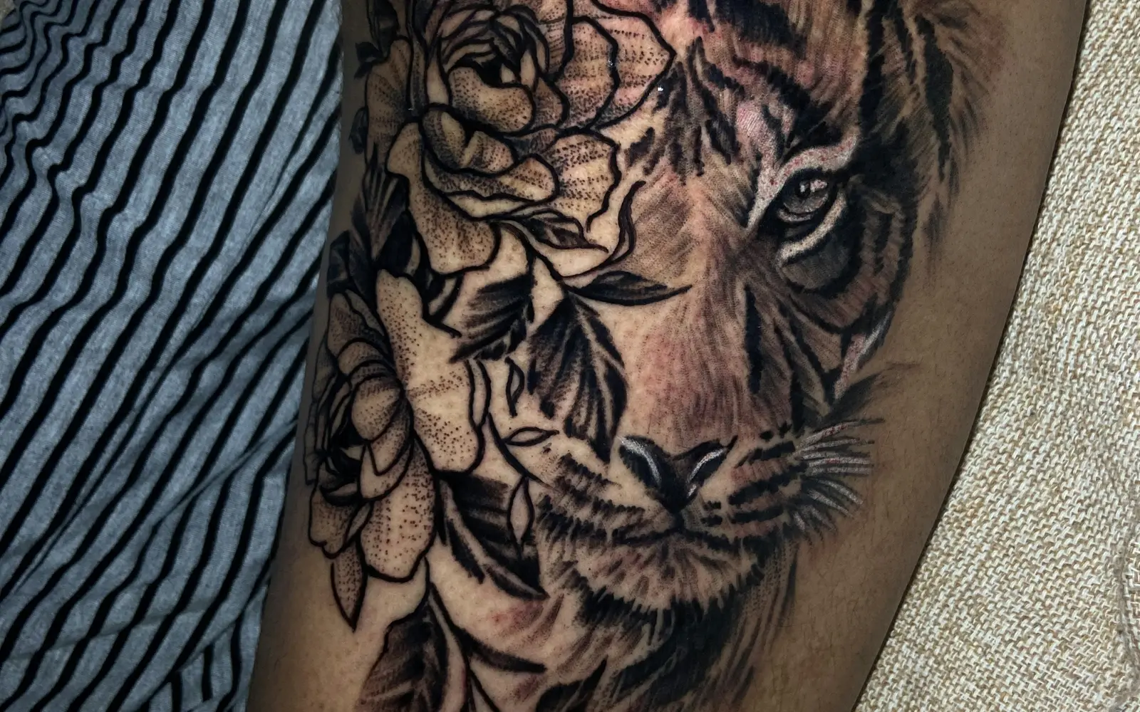 3D tiger and floral tattoo on thigh